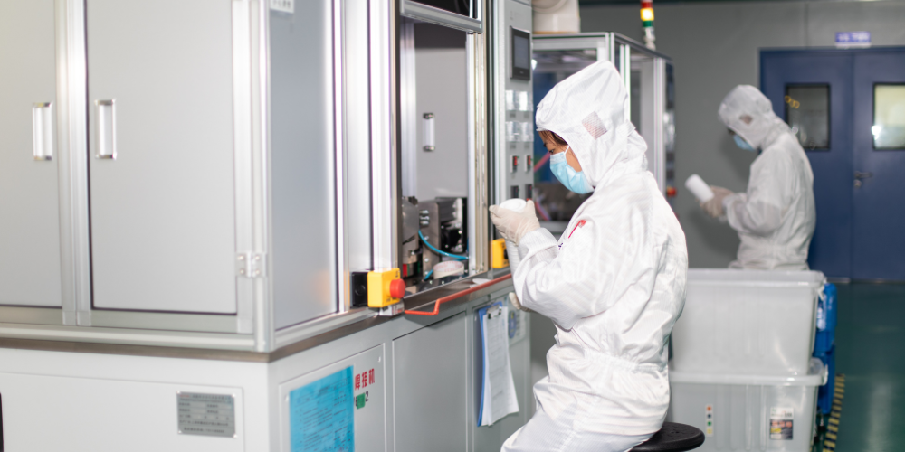 Workers in clean area for filtration product handling